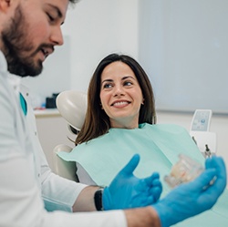 Dentist discussing dentures with patient