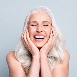 a patient with dental implants smiling