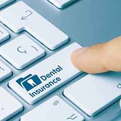 Patient in Norwalk checking dental insurance for Dental implants