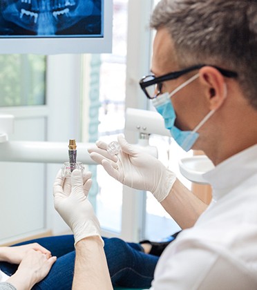 A woman seeing a dental implant dentist in Norwalk