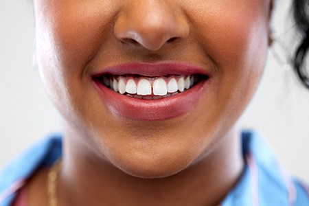 A woman with a small gap between her teeth