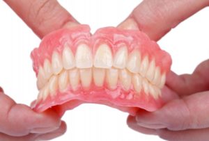Holding Dentures