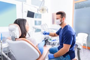 woman talking to cosmetic dentist in Norwalk