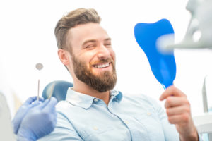 Man smiling in mirror